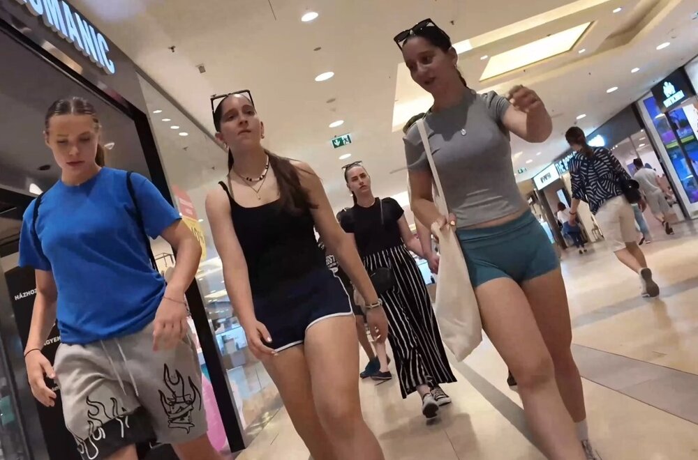 Teen in shorts and a V-neck top with friends (4).jpg