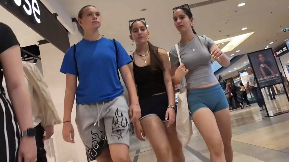 Teen in shorts and a V-neck top with friends (5).jpg